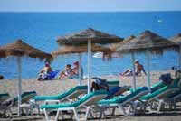 Sunbeds on beach